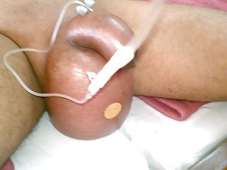 My friend doing saline infusion in my balls first time 