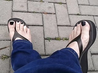 black toenail polish and black platform flip flops