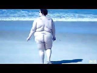 Fat Slut walking on beach