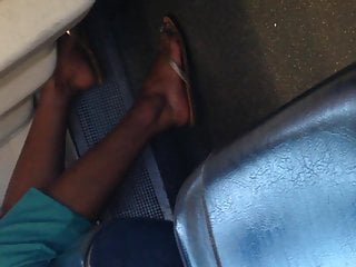 Indian woman barefoot shoe change on train 