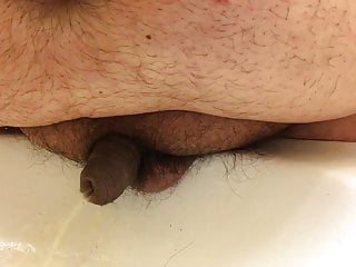 ultra close view of chub&#039;s tiny uncut willy peeing