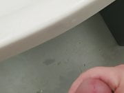 Stroking cock in a public shower room