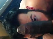 Hot bearded guy blows a big black cock