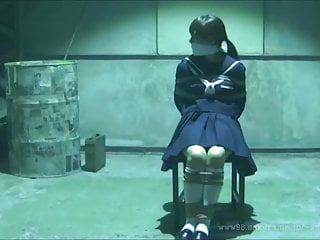 Japanese Schoolgirl tied and gagged in warehouse