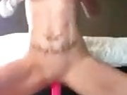 Tttooed bit tits squirting on top of dildo