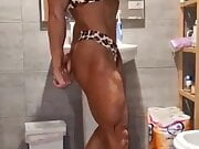 huge bodybuilder girl posing in bikini