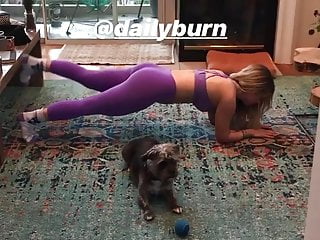 Joanna JoJo Levesque doing hot yoga on the floor
