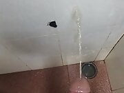 Pissing on the wall, man cock dripping