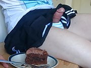Cute crossdresser cums on cake and eats it
