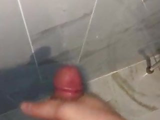 Asian guy large cum load on the bathroom wall