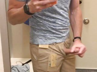 Wanking in the clothing store public fitting room