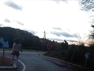 schoolgirl flashing on traffic circle roadsigns plugged