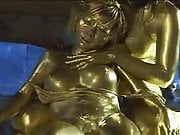 Queen tortures gold painted slave