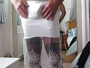 Tight white skirt showing suspender bumps