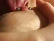 Licking and sucking pierced nipple 