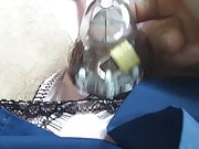 Locked in chastity under the nylon smock