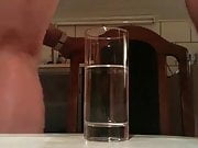 Underwater cumshot in glass of water