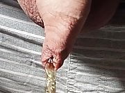 Close-up foreskin peeing slowmo