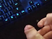 Man solo masturbating to a cumshot on keyboard