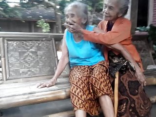 2 very old grannies kissing...