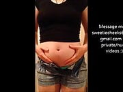 Stuffed swollen belly in tight clothes