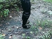 Vinyl mini skirt, thigh high boots in deep mud!