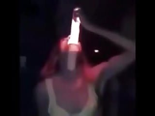 Girl deepthroats a really huge illuminated dildo