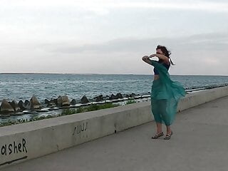 Dancing by embankment with blue shawl...