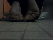 Ebony chick showing soles
