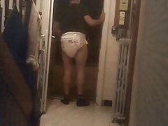 Baby takes out the trash in diaper