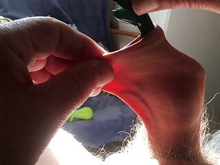 Three minutes of foreskin stretch in sunlight: pliers  