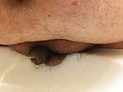 ultra close view of chub's tiny uncut willy peeing